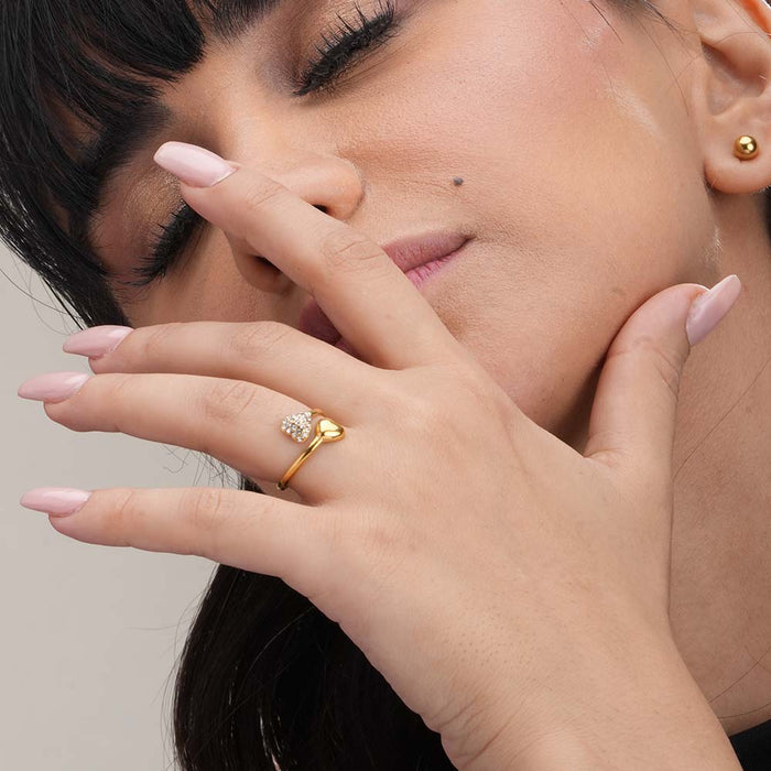 Gold Heart-Shaped Ring with Gemstone Accents.