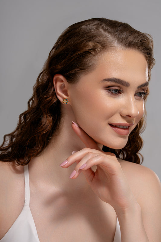 Model wearing Petal Radiance Studs, showcasing their vibrant gemstone detailing and delicate floral shape for a chic accessory look.