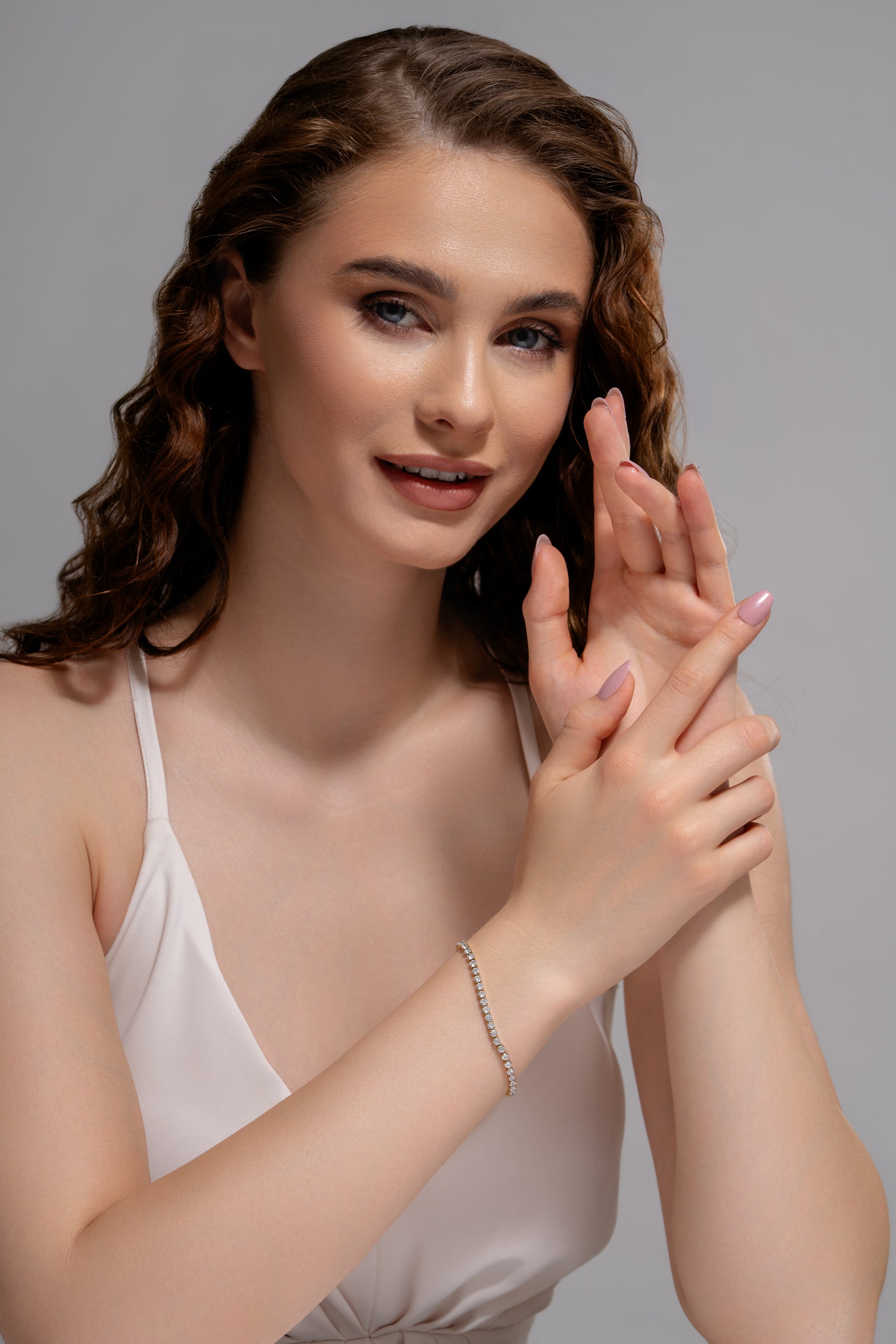 Model wearing Celestial Radiance Tennis Bracelet, highlighting its delicate design and radiant sparkle, perfect for upscale fashion accessories.