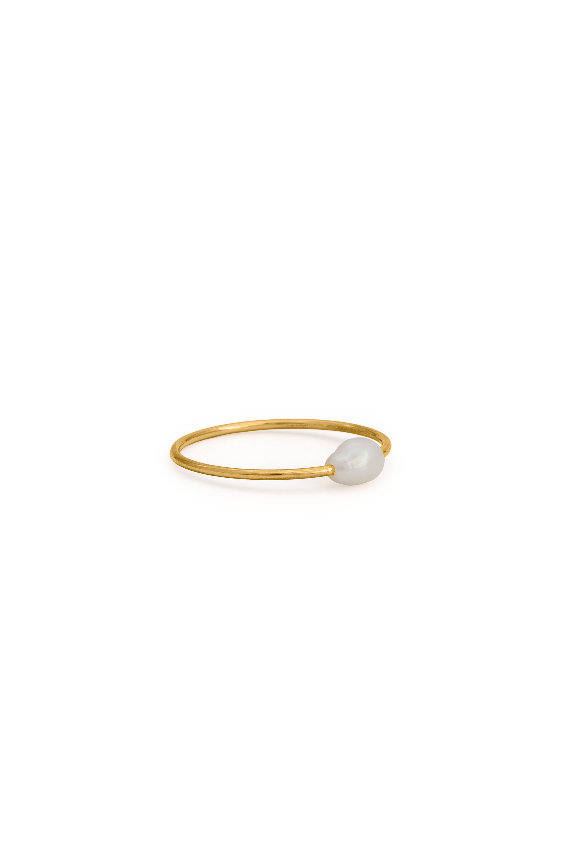 Close-up of the Celeste Pearl Ring with a slim gold band and a single white pearl, perfect for stacking or solo wear.