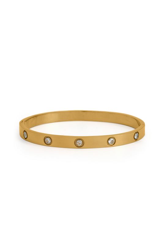 Lumière Crystal Bracelet in gold-tone metal with evenly spaced round-cut crystals, ideal for elegant wrist styling.