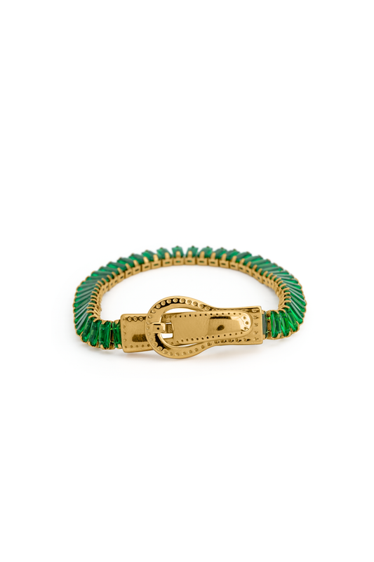 Close-up of Emerald Baguette Tennis Bracelet featuring green baguette-cut stones and a gold buckle clasp, ideal for upscale fashion accessories.