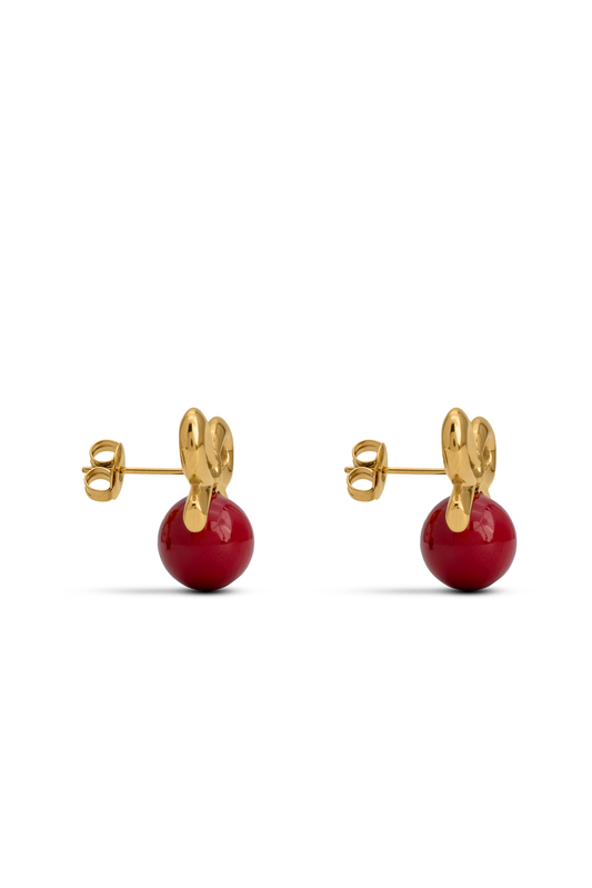 Red Orb & Gold Bow Stud Earring featuring a glossy red orb and polished gold bow, ideal for elegant everyday wear or gifting.