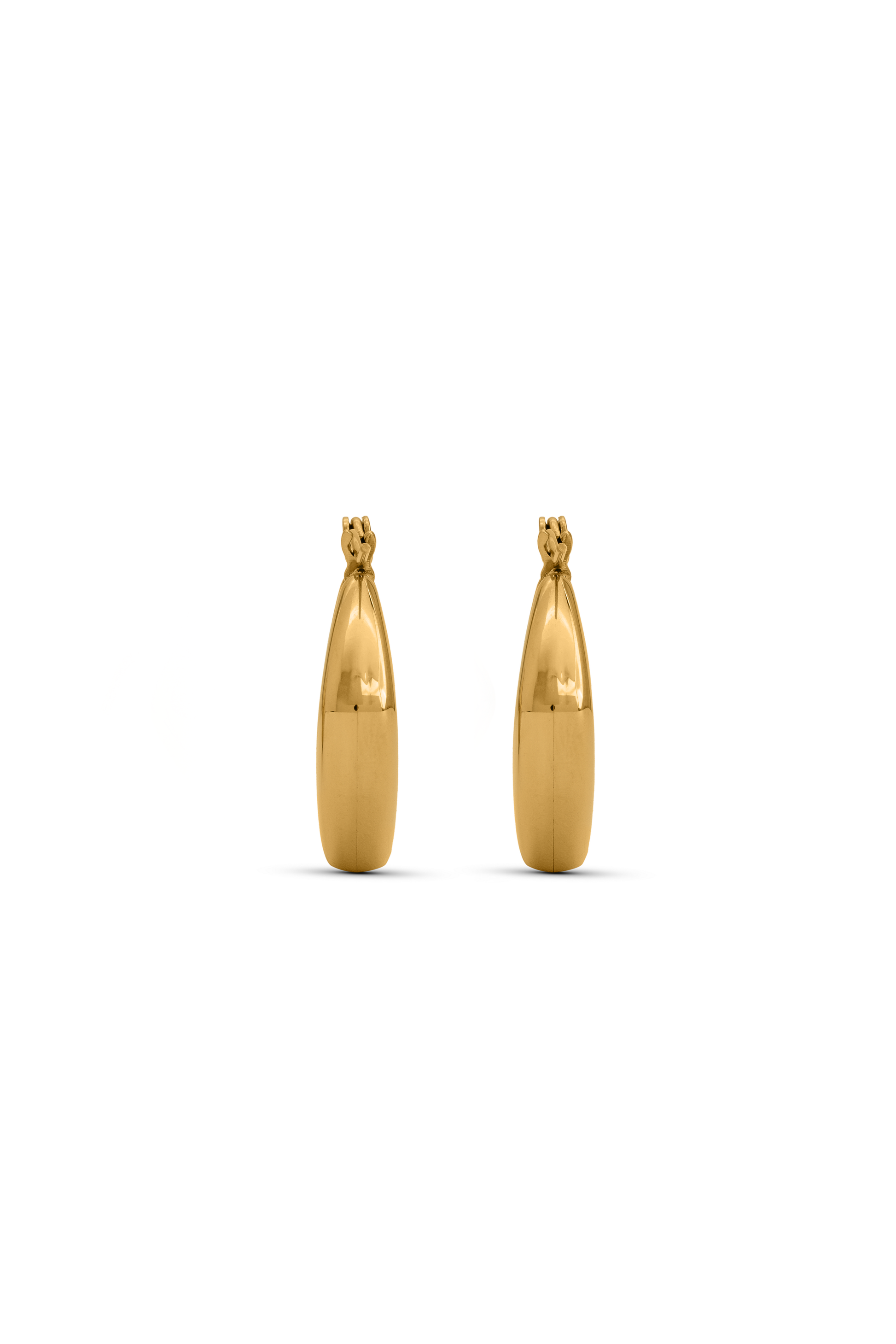 Pair of Bold Geometric Gold Hoop Earrings shown from the side, emphasizing their thick, sculptural design for luxury jewelry styling.