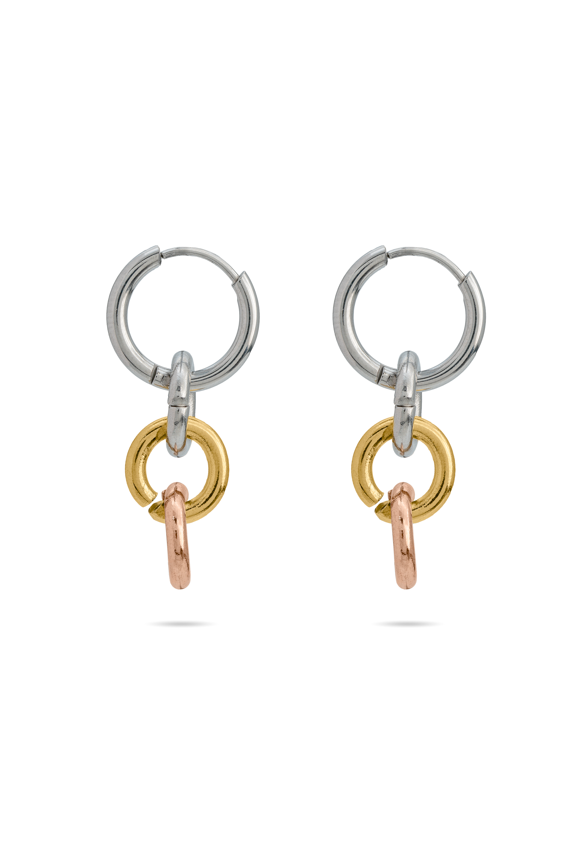 Harmony Hoops tri-tone earrings featuring interlinked silver, gold, and rose gold rings. Modern jewelry in the Earrings category.