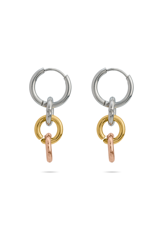 Harmony Hoops tri-tone earrings featuring interlinked silver, gold, and rose gold rings. Modern jewelry in the Earrings category.