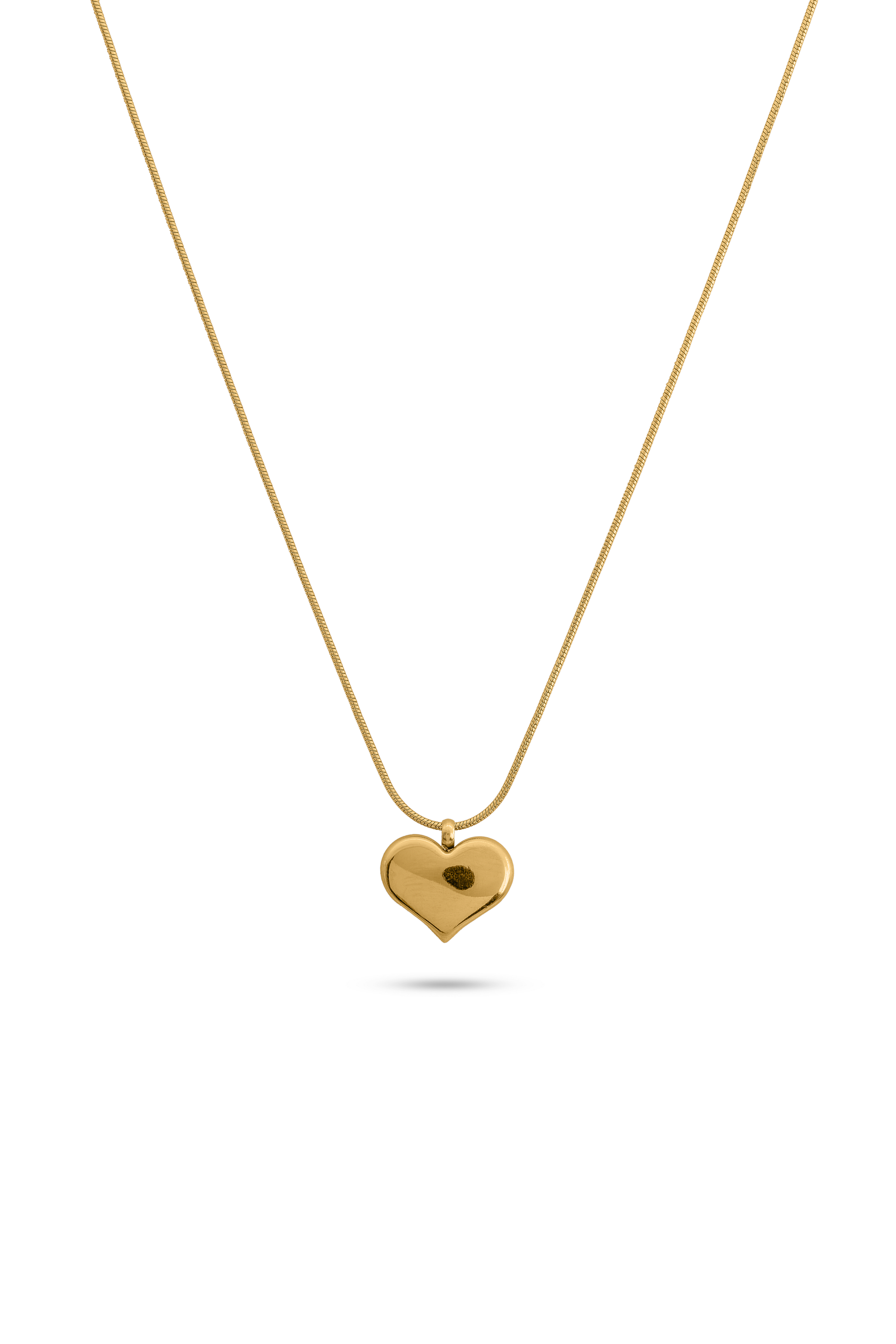 Gold chain necklace with heart pendant displayed on white background, showcasing its elegant and minimalist jewelry design.