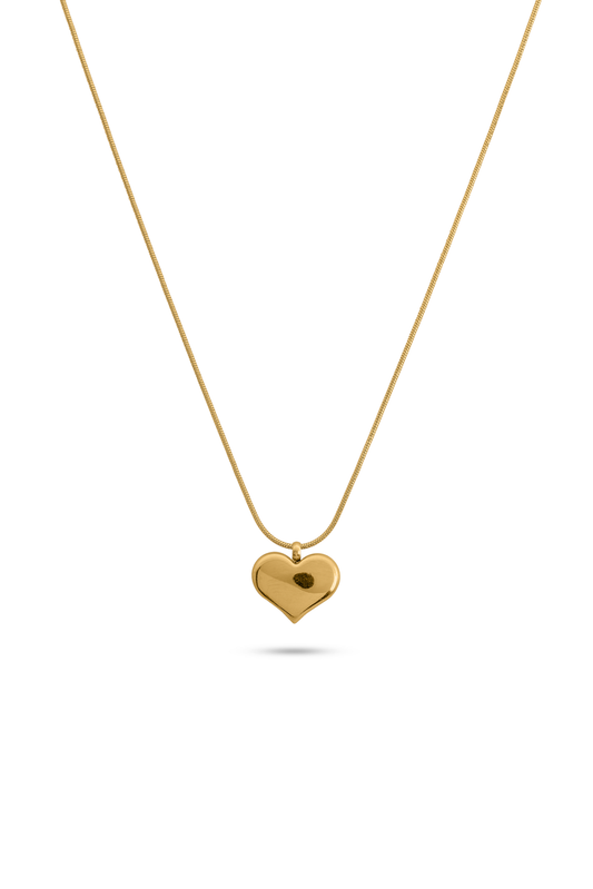 Gold chain necklace with heart pendant displayed on white background, showcasing its elegant and minimalist jewelry design.