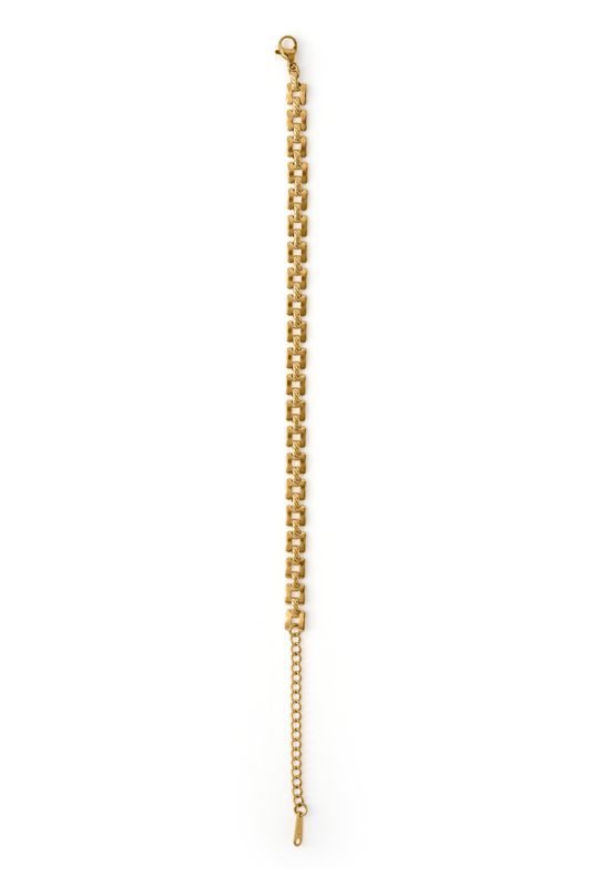 Stackable Radiance Bracelet laid flat showing gold chain link pattern and clasp, perfect for elegant and versatile styling.