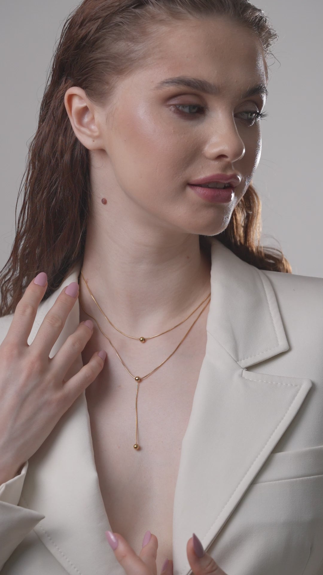 Close-up of Beaded Drop Necklace on a model, emphasizing the fine gold chain and bead arrangement, perfect for modern jewelry styling.