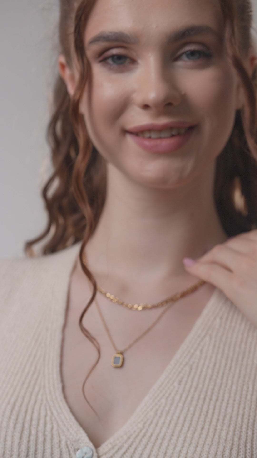 Close-up of model wearing Black Onyx Layered Necklace, highlighting the gold chain detail and black gemstone pendant for fashion-forward accessorizing.