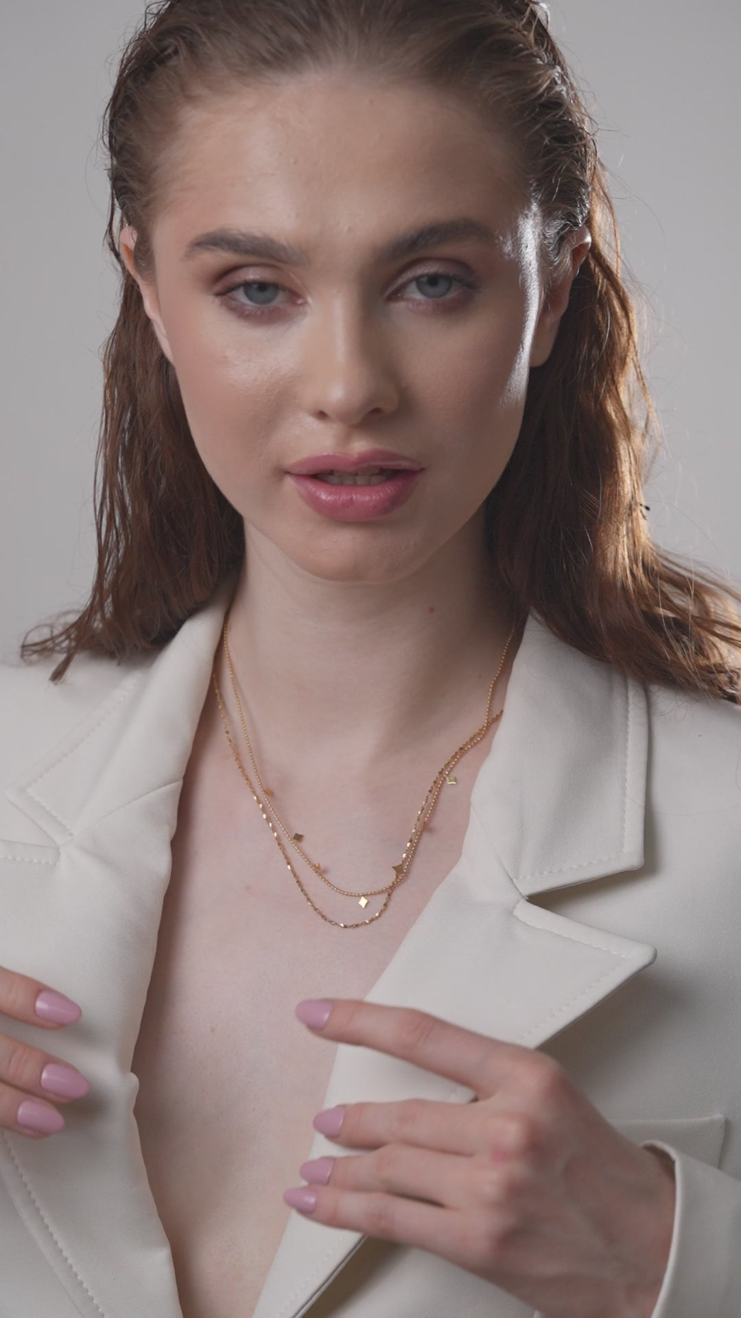 Close-up of Dusk Gleam Layered Chain on model, emphasizing the necklace's fine gold finish and layered elegance for contemporary jewelry appeal.