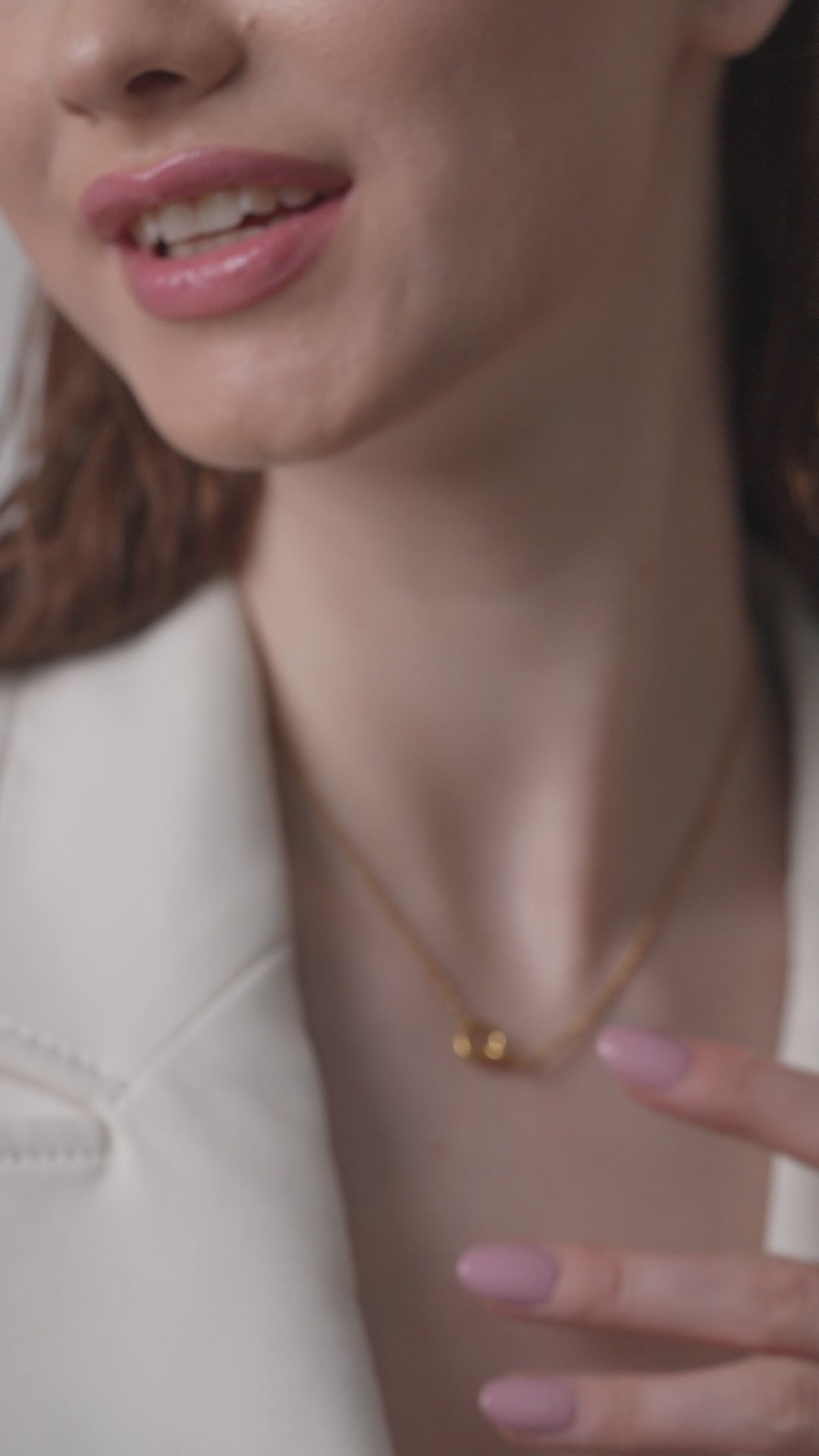 Close-up of Eternal Grace Necklace on model, emphasizing the dainty interlocking gold rings for a chic and timeless jewelry accessory.